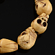 手作り彫り加工OX骨ビーズ  ハロウィーンのジュエリーには頭蓋骨アンティークビーズ  淡い茶色  11x9x8mm  穴：1mm BONE-S001-04-1