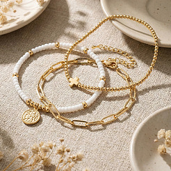 3-teiliges Set aus stapelbaren Armbändern mit Glasperlen und Messinganhängern&nbsp;NI4761
