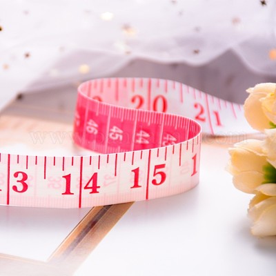 Measure Tape And Scales On A Pink Background With The Words Excess