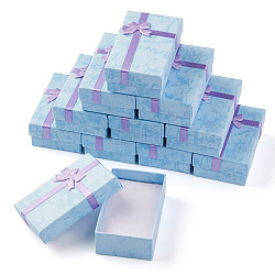 Yilisi 12pcs cajas de joyería de cartón, con la almohadilla de esponja en el interior, para aniversarios, bodas, cumpleaños, Rectángulo con bowknot, luz azul cielo, 8.25x5.3x2.65 cm, tamaño interno: 7.55x4.65 cm, 12 PC / sistema