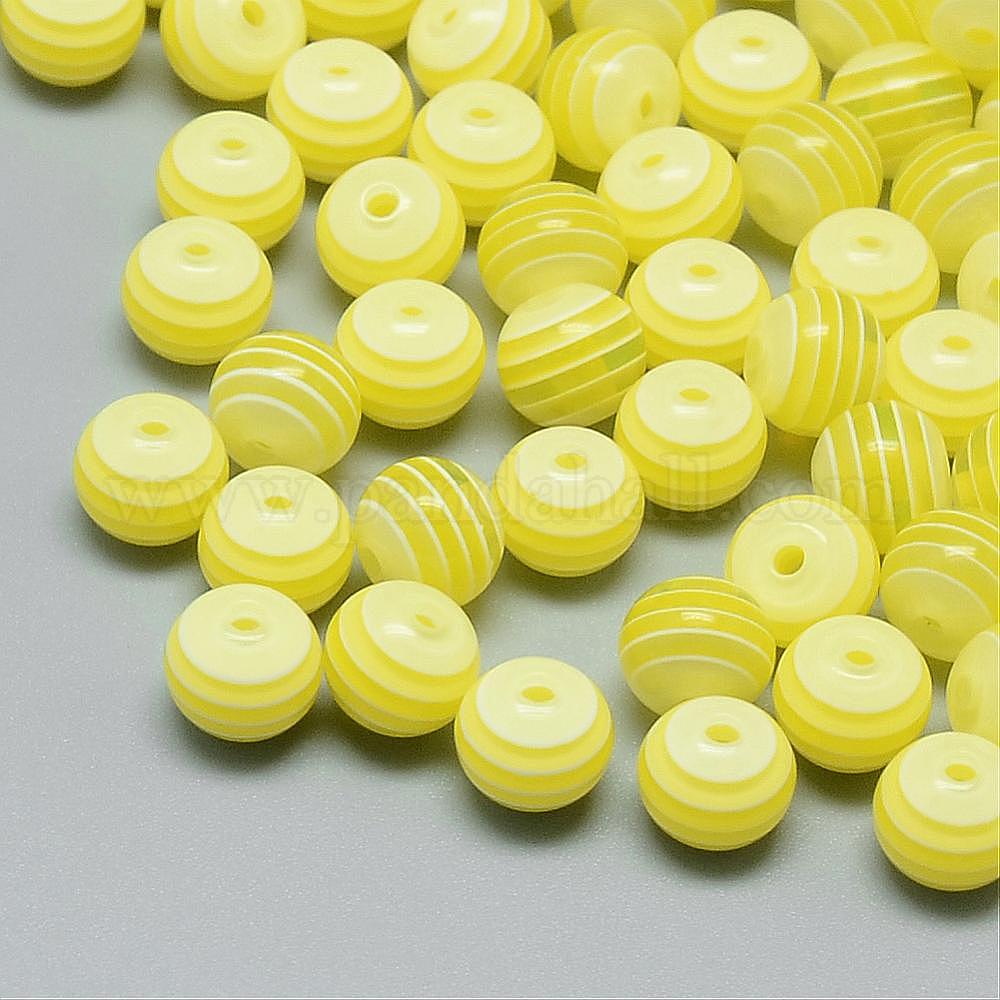 Braccialetto con perline in resina avorio: ciondolo massiccio