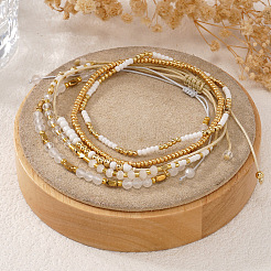 5-teiliges Set aus Glas- und Metallarmbändern mit gold-weißen Perlen&nbsp;AB9103-3